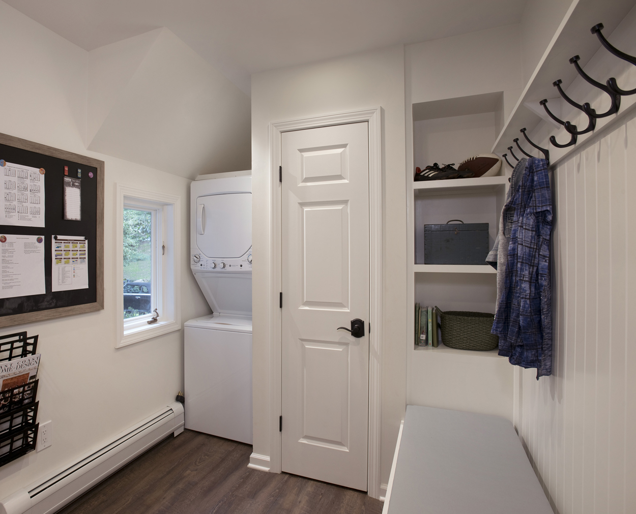 Mudroom with laundry center and built in storage helps clients stay organized.