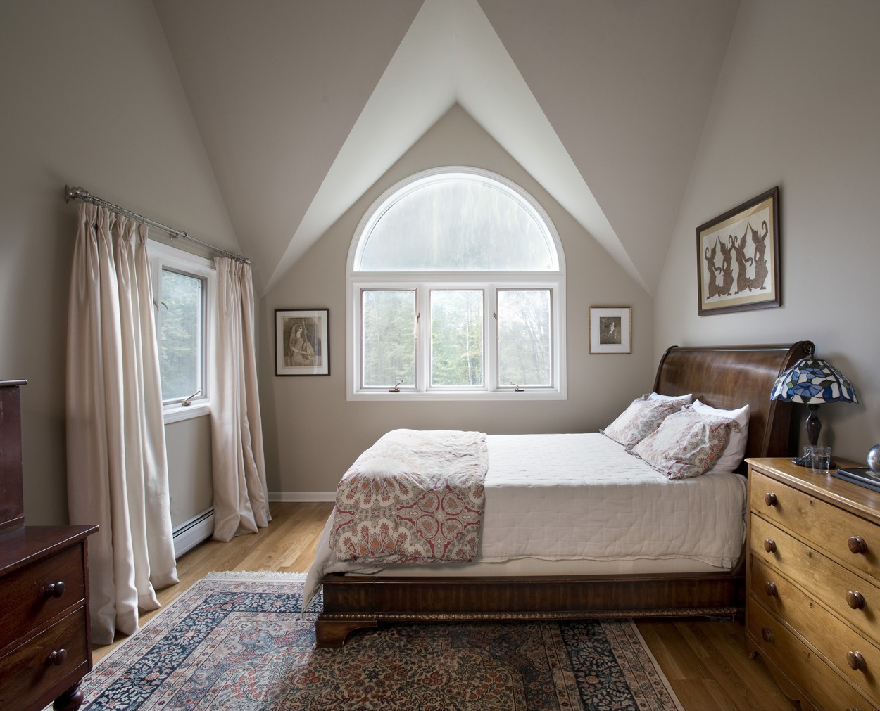 Guest bedroom with soft grey walls.