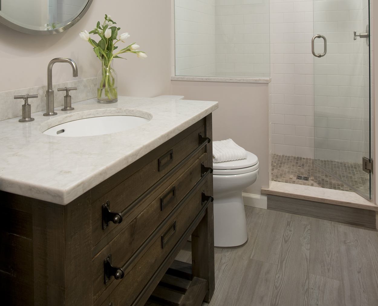 Restoration Hardware vanity and frameless shower door.