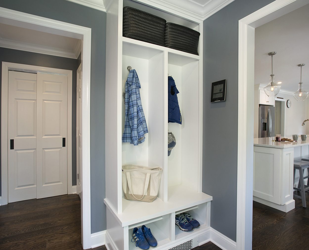 Mudroom and kitchen in Clark Construction's whole house remodel design