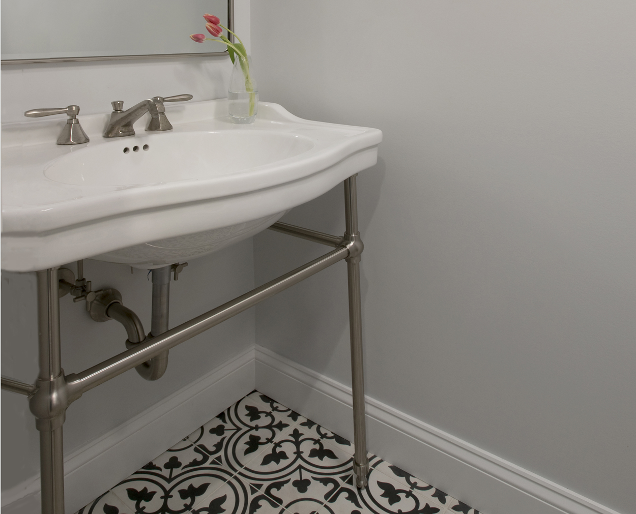 Powder room with concrete tile and freestanding vanity