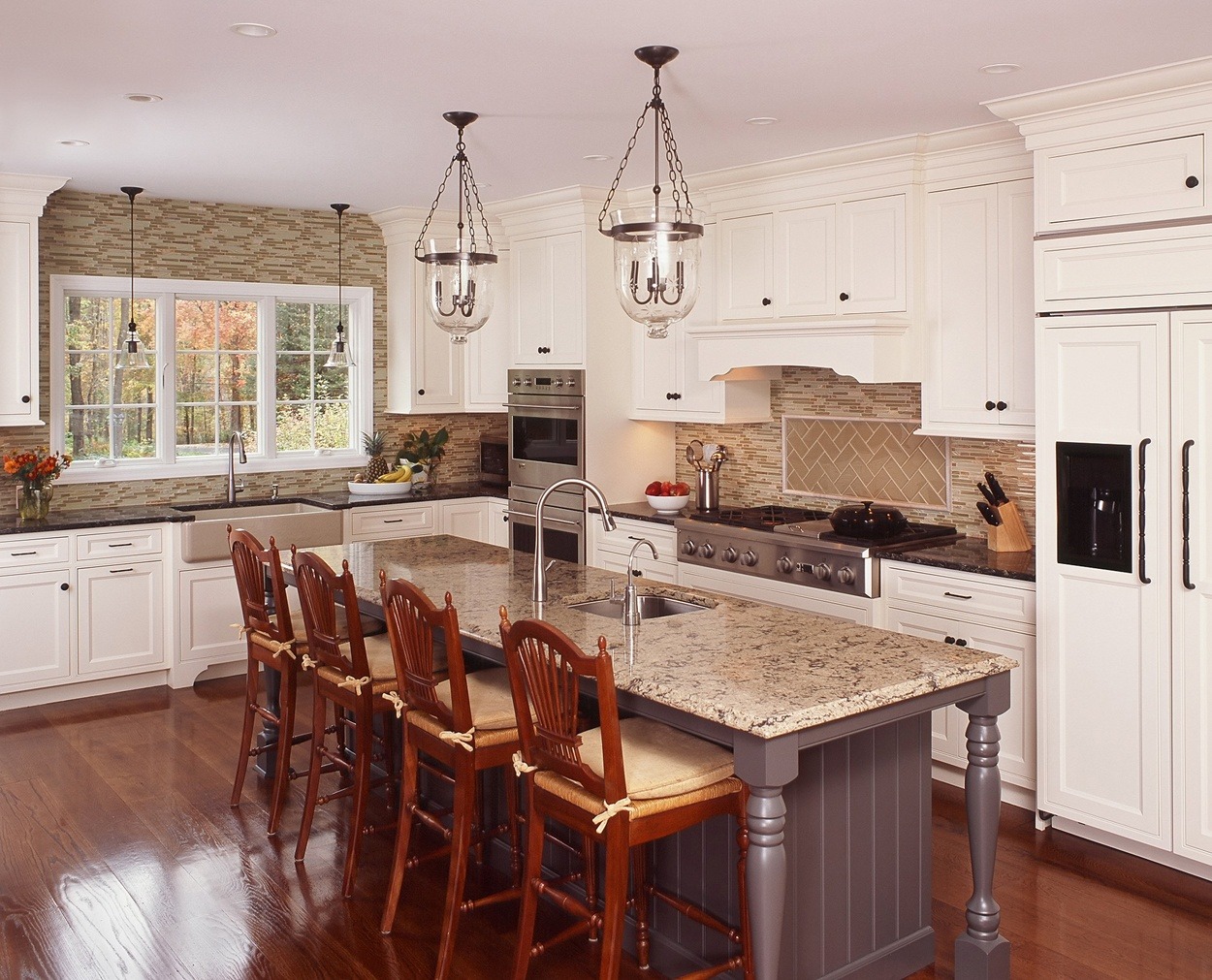 Center island, painted grey, anchors this Redding, CT kitchen.