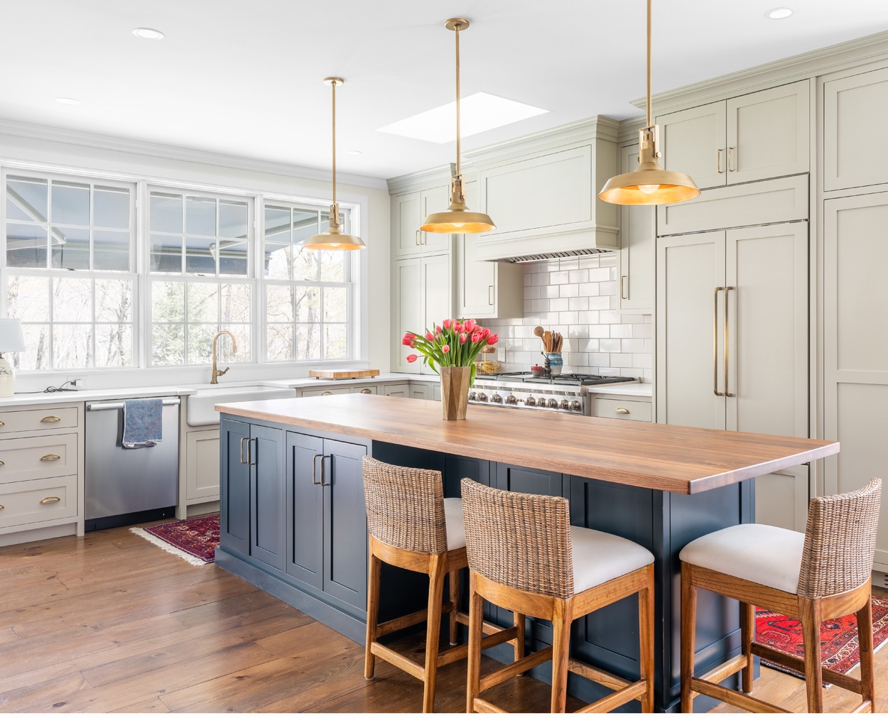 Traditional inset kitchen features stunning blue island