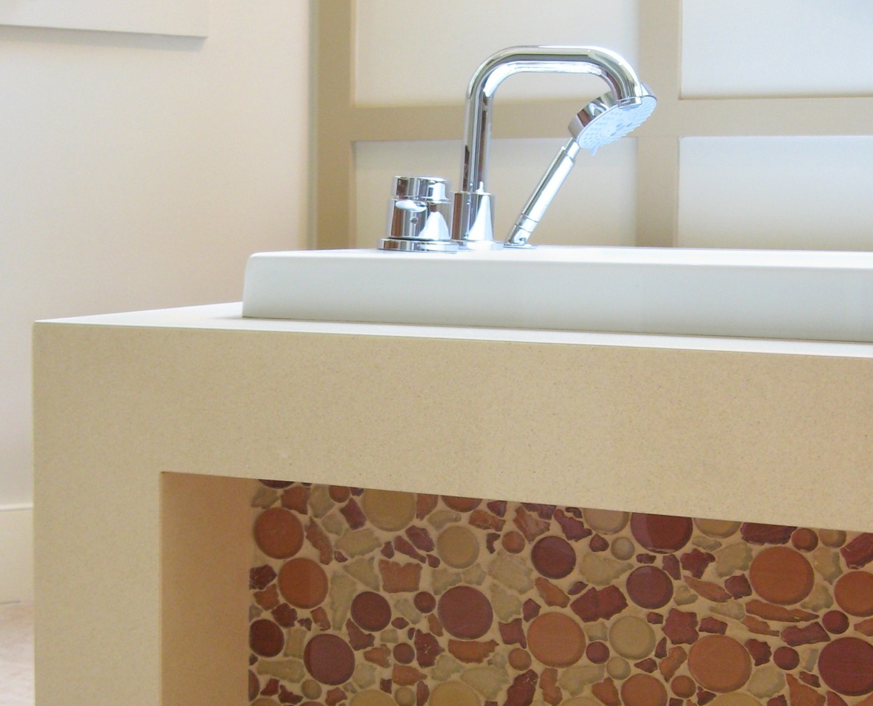 Detail of tub faucet on a modern bath.