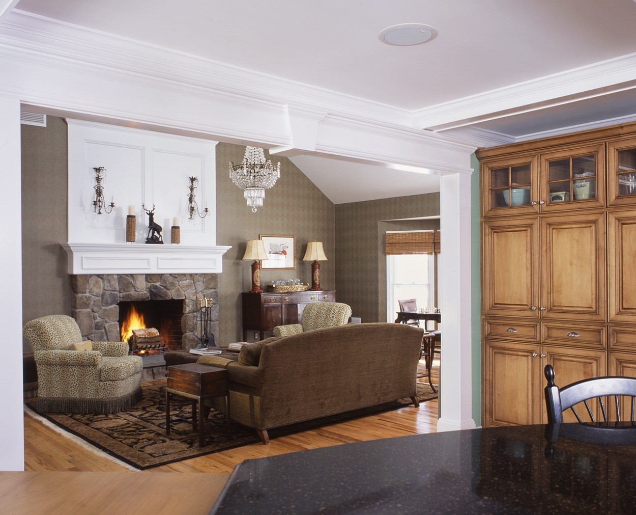 Stone fireplace surround gives this livingroom a warm feel.