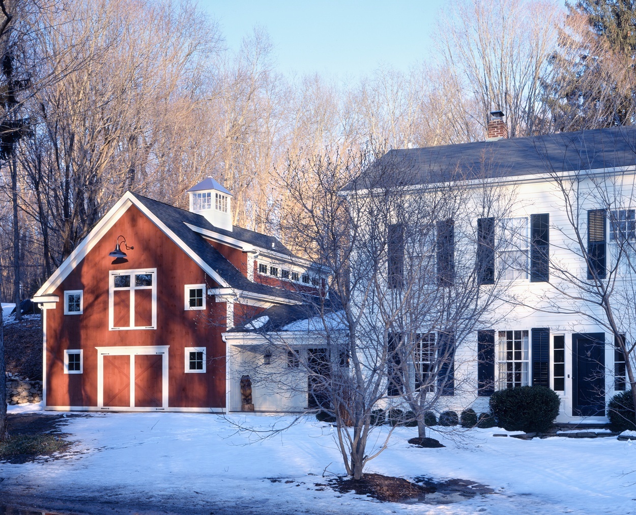 Wilton, CT colonial with new barn style garage with shed dormer.