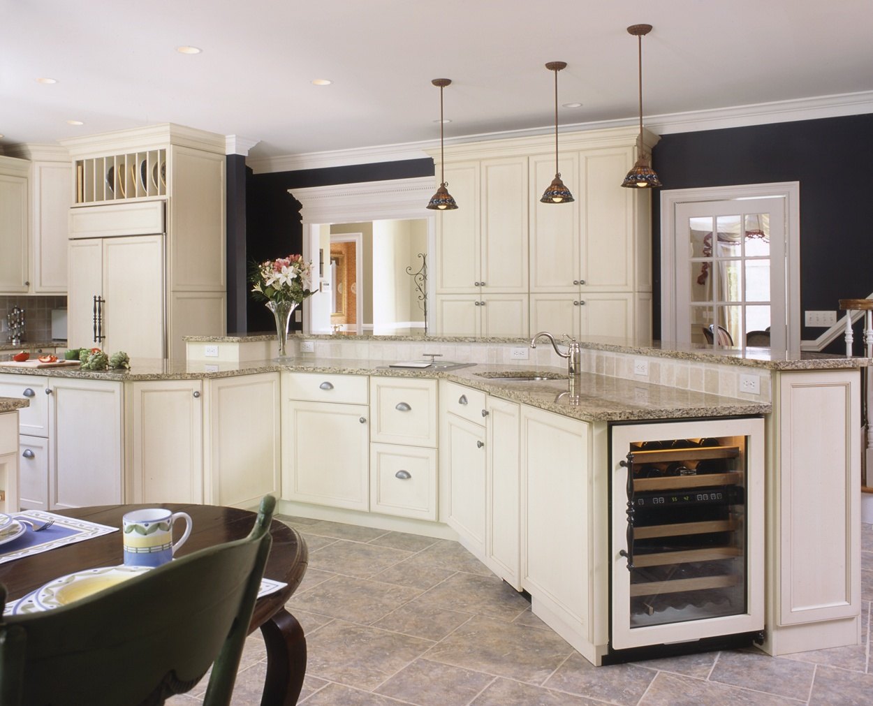 A kitchen for entertaining with a large bi-level island designed by Clark Construction.