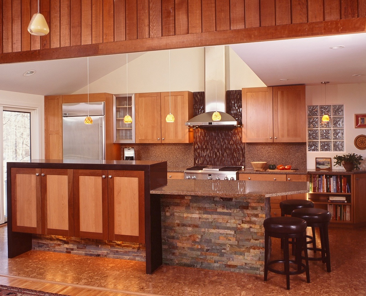 Modern birch Grabill cabinets with a light stain in this well designed kitchen.