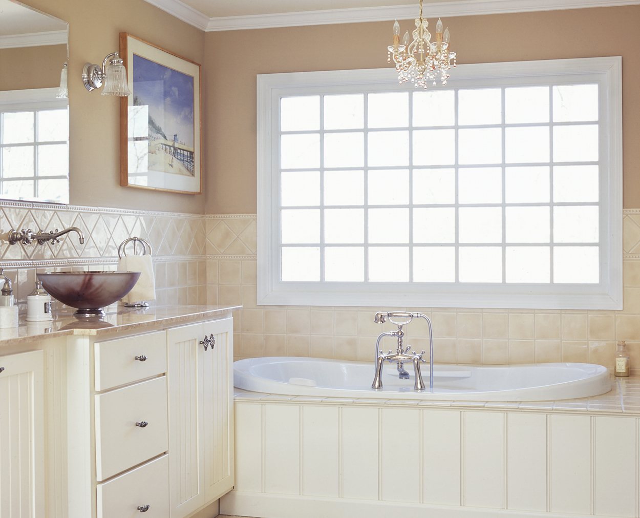 Beadboard tub front, with shake white cabinets and vessel sinks in Clark Construction bath renovation.